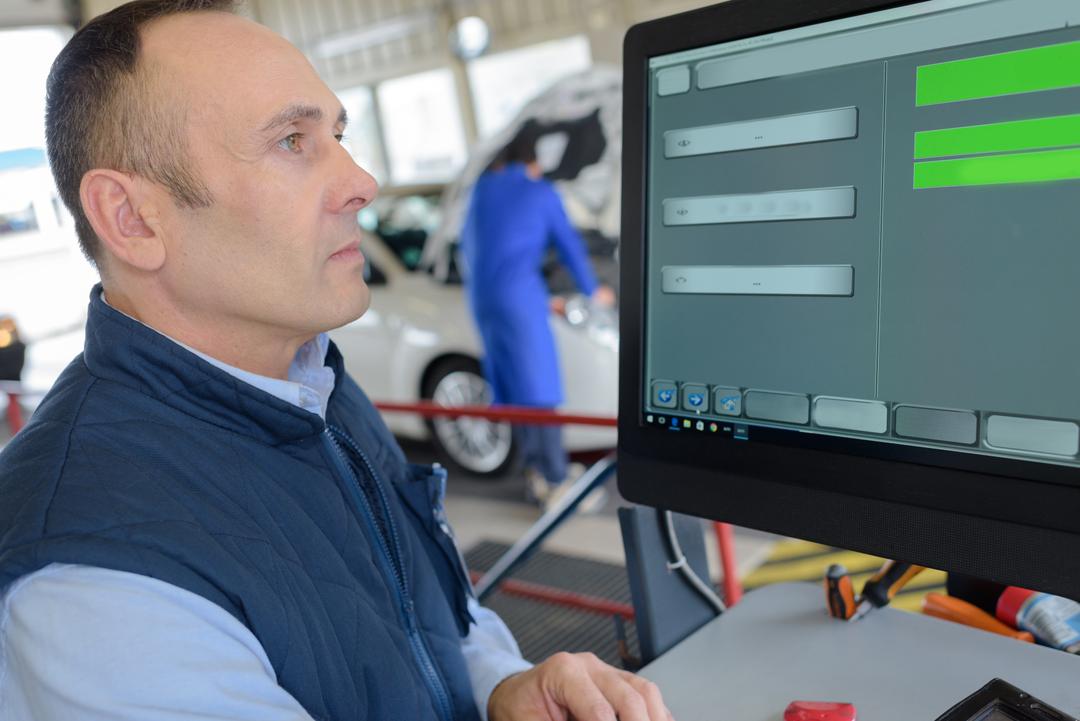 picture of a man testing a car for diesel emissions