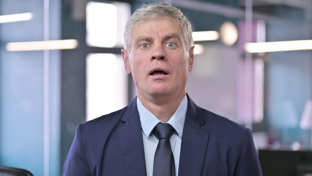 a diesel car executive looking shocked at being found out